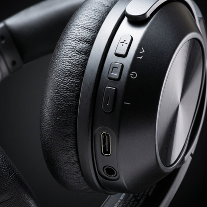 A detailed macro photograph showing the precise control interface and input panel on the SHARP HP-60 headphone earcup.