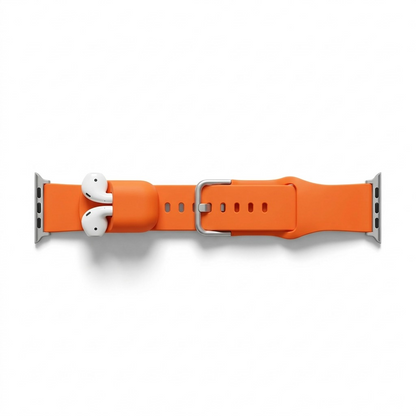 Electric Orange KeyBudz Sync+ Series FKM Apple Watch strap featuring an integrated AirPods dock.